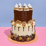 2 Tier Ferrero Rocher & Cookie Dough Cake with chocolate, hazelnuts, cookie dough, and buttercream by Crumbs & Doilies